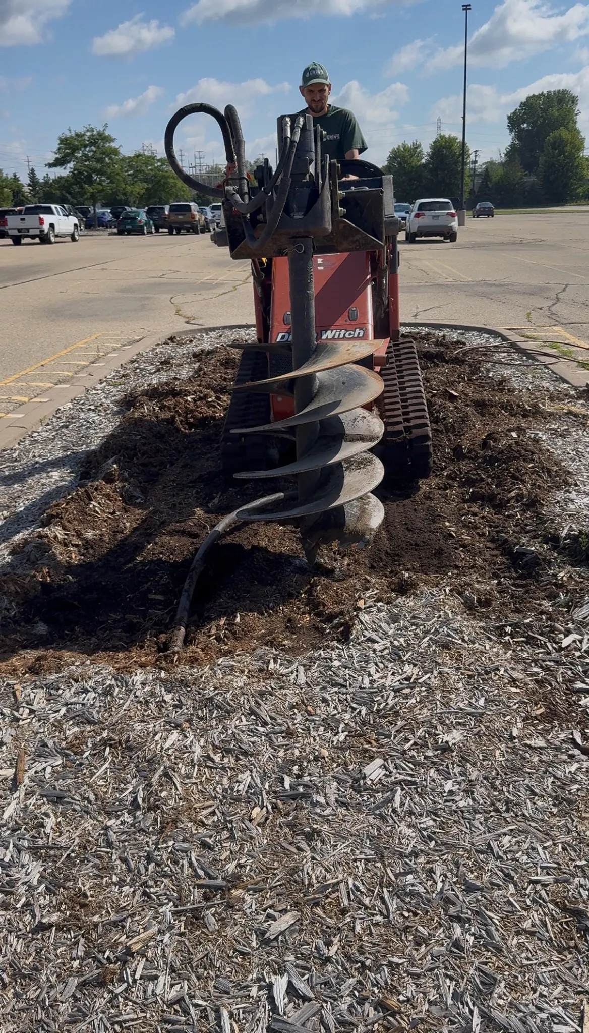 Tree hole drilling with Ditch Witch auger